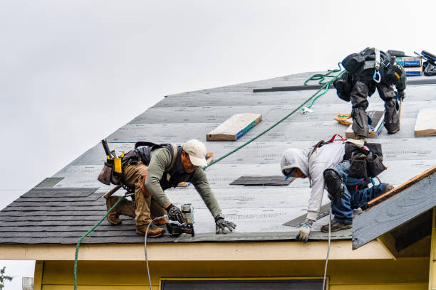 Professional Gutter Installation technician working in Groton, MA